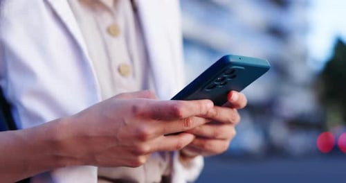 Woman, phone and hands typing in city for networking, online browsing or outdoor communication