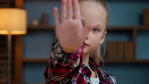 Cute Girl Posing with Hand Up Indoors