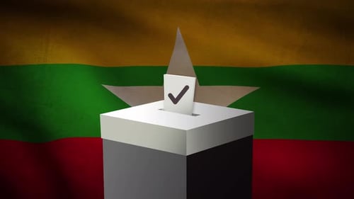 Casting vote into the ballot box during Myanmar election