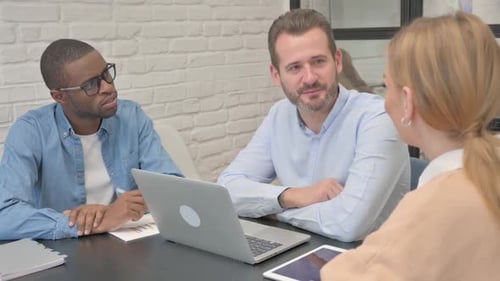 Young Business People Talking in Office