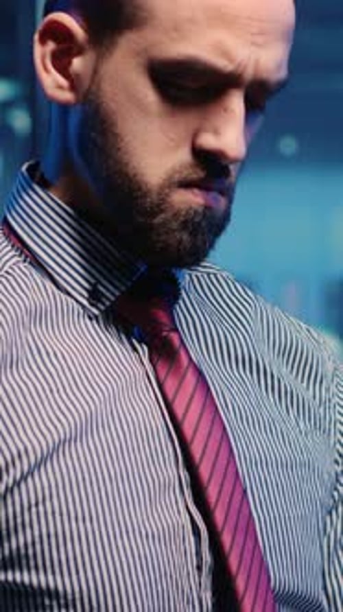 Vertical Video Data Center IT Engineer Standing Next to Server Cabinets