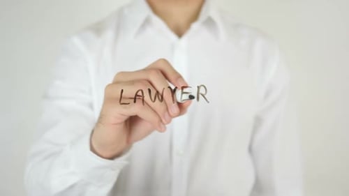 Hand Writes Lawyer on Clear Surface