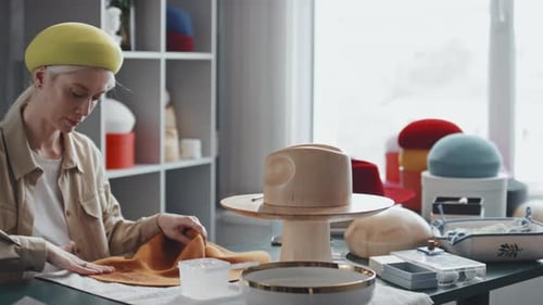 Hat Maker Shaping Stylish Hat in Workshop