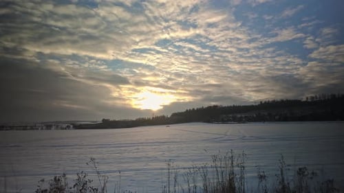 Sunset over a winter landscape covered in snow