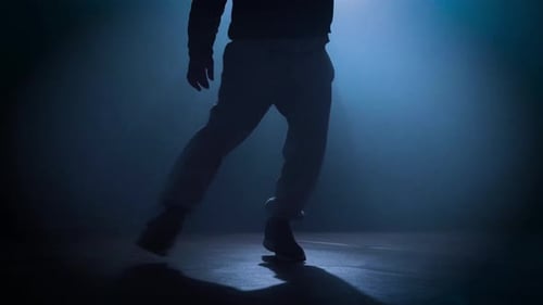 Silhouette of a Man Dancing Break Dance in a Dark Studio Dancer Artist Performing