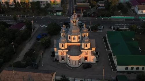 An Aerial View of a Beautiful and Serene Church at Sunset Capturing Its Architectural Splendor