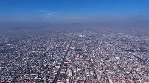 Urban aerial perspective of hazy Mexico City area
