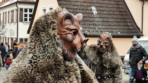 Masquerade traditional processions.Leopard costume and mask. People in leopard print costumes