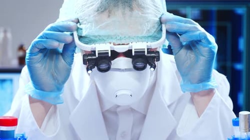 Scientist Adjusting Goggles in Research Laboratory