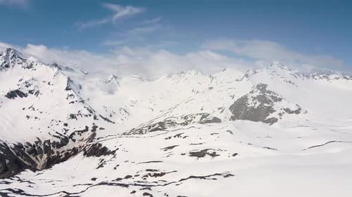 Aerial View Drone Panorama Over the Snowy Peaks of the Caucasus Mountains