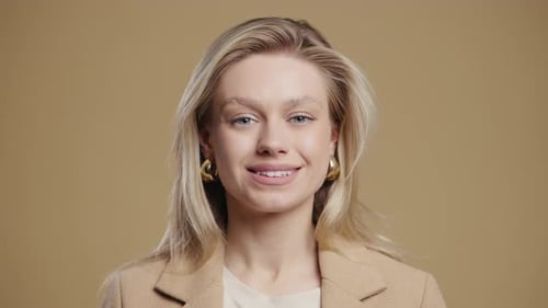 Blonde Woman Winking and Smiling in Close Up