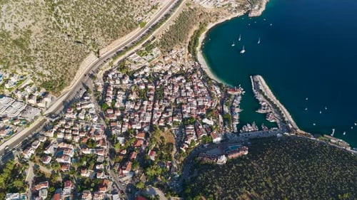 Aerial Video of Town Near Sea With Hills and Dawn Colors