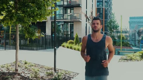 Man Jogging in an Urban Environment on Sunny Day