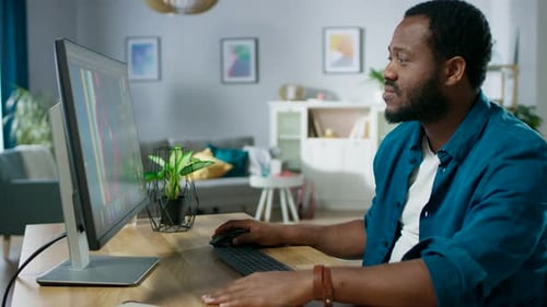 Professional Photographer Works in Photo Editing App / Software on His Personal Computer. Photo Edi