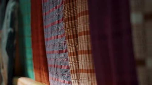 Handmade Textile Detail - Colorful Mayan Textiles For Sale In A Souvenir Shop - Rack Focus
