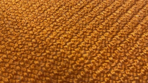 Macro View of Textured Orange Fabric
