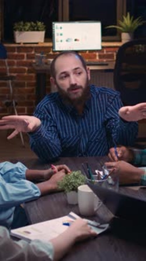 Business Meeting at Night in Modern Office