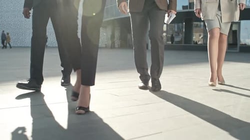 Group Of Business People Walking Through Modern Office Building Bottom View,