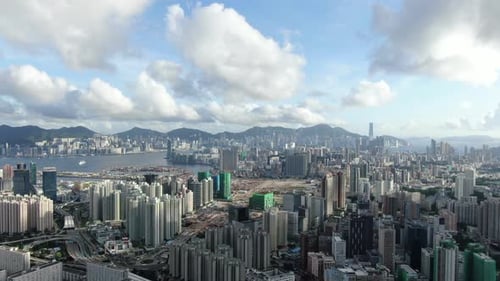 Hong Kong Urban cityscape with buildings and traffic above Kowloon, High altitude aerial view.