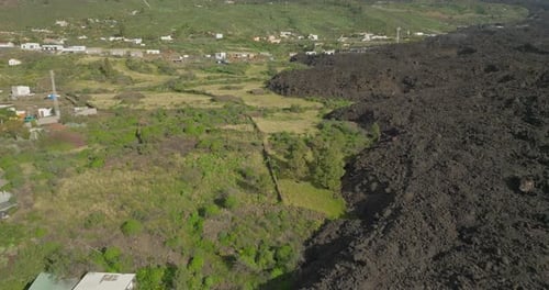 Basalt rock from lava flow on edge of farm land, natural disaster