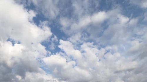 Clouds Move Across Blue Sky during the Day