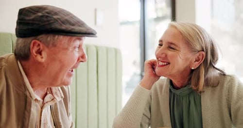 Happy, talking and mature couple at coffee shop for bonding, conversation and relax together
