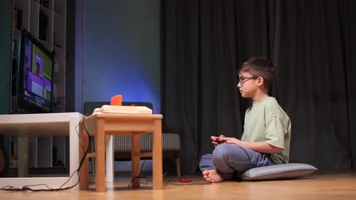 Boy Playing Pixelated Video Game