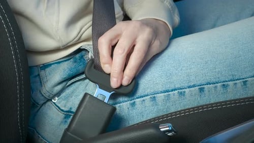 Woman Fix Belt in Car Cabin