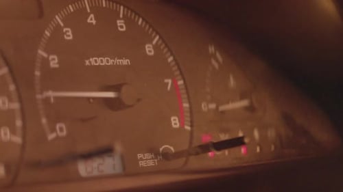 Close up of RPM speedometer rising in a speeding car