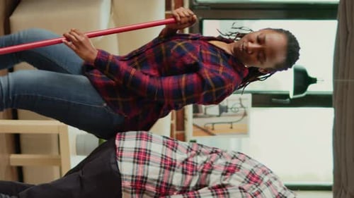 Vertical Video Cheerful People Showing Dance Moves and Doing Spring Cleaning
