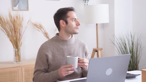 Man Working from Home with Coffee