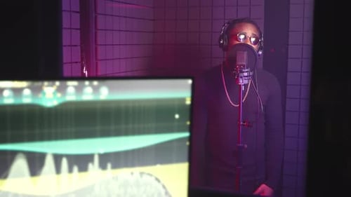 Professional Music Production Studio Black Male Singer is Recording New Song Portrait