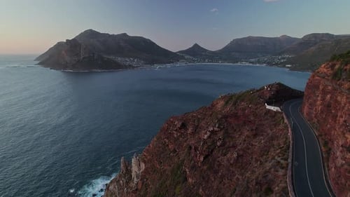 Fly Over Chapman's Peak Drive Overlooking Hout Bay During Sunset In Cape Town, South Africa. Aerial