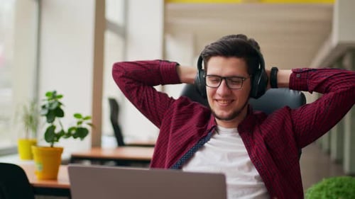 Man Working at Laptop in Modern Office
