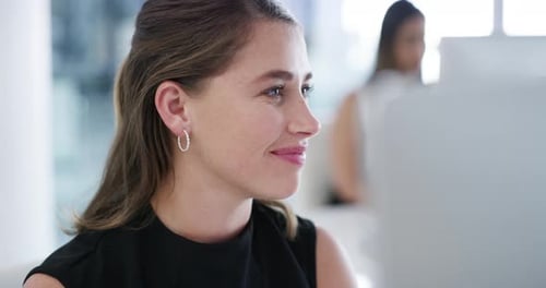 4k video footage of a young businesswoman working on a computer in an office