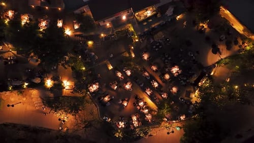 Aerial Video of Night Dining Area with Crowd and Lights