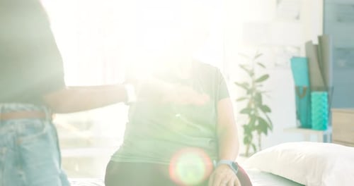 Senior Woman Exercising with Healthcare Worker
