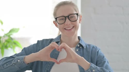 Smiling Woman Making Heart With Hands