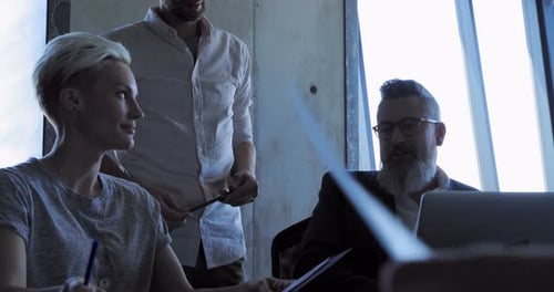 Business team in office discussing construction plans