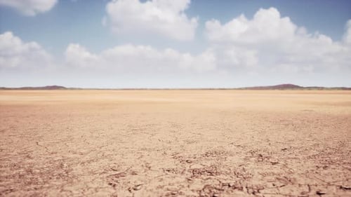 Moving Across Dry Cracked Earth Desert Landscape