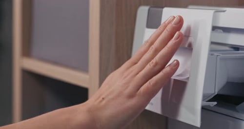 Person Closes Washing Machine Detergent Drawer