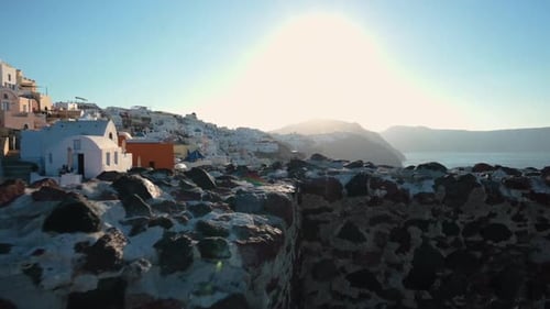 Revealing shot of typical white buildings on Greek island Santorini, Greece