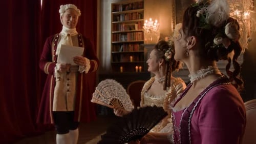 Trio in Period Clothing Holding Fans and Papers