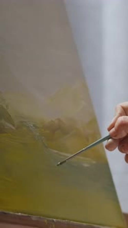 Woman's Hand Finely Painting with Brush on Canvas