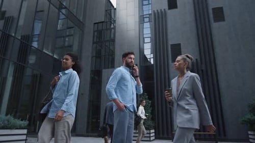 Serious businessman makes important phone call in the downtown business district