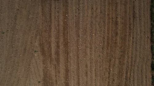 Aerial View of Farm Land Tilling in Field