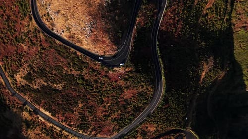 Serene Mountain Pathway Adventure Aerial Shot Showcasing Rugged Mountain Switchbacks Amid Autumn