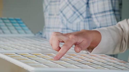 Customer Chooses Building Materials in Image From Catalog