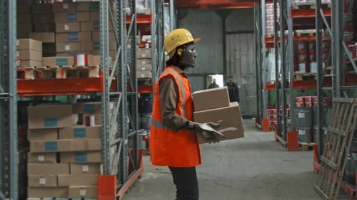 Robot Worker Carrying Boxes in Warehouse