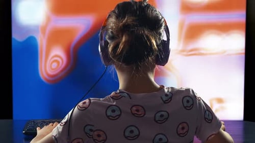 A Child or Teenager is Playing a Computer Video Game